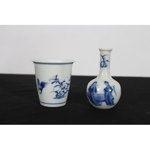 430 - A MINIATURE CHINESE BLUE AND WHITE VASE the blue and white ground decorated with figures in a landsc... 