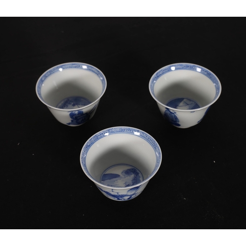 431 - A SET OF THREE CHINESE BLUE AND WHITE CUPS each of circular tapering form decorated with figures and... 