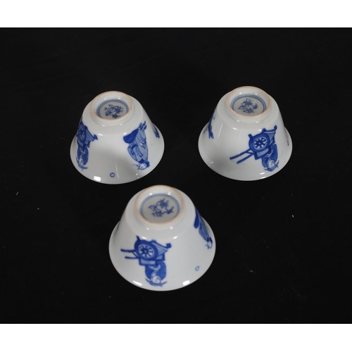 431 - A SET OF THREE CHINESE BLUE AND WHITE CUPS each of circular tapering form decorated with figures and... 