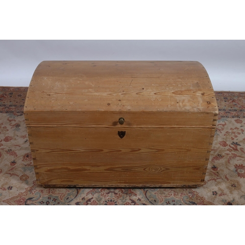 60 - A VINTAGE PINE TRUNK of rectangular bowed outline the hinged lid above a moulded frieze with steel c... 