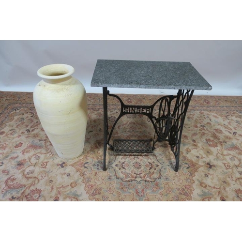 644 - A CAST IRON AND MARBLE PATIO TABLE the rectangular green veined marble top above a cast iron singer ... 