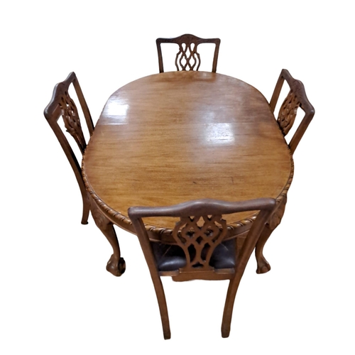 81 - A CHIPPENDALE STYLE MAHOGANY FIVE PIECE DINING ROOM SUITE comprising four chairs each with an arched... 