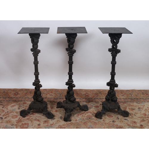 85 - A PAIR OF 19TH CENTURY CAST IRON PEDESTALS each with a square moulded top above a fluted turned colu... 