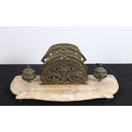 90 - A BRASS AND MARBLE DESK STAND the serpentine shaped base surmounted by lidded inkwells and letter ra... 