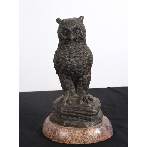 93 - A BRONZE FIGURE modelled as an owl shown perched on a rockwork base with veined marble plinth
37cm (... 