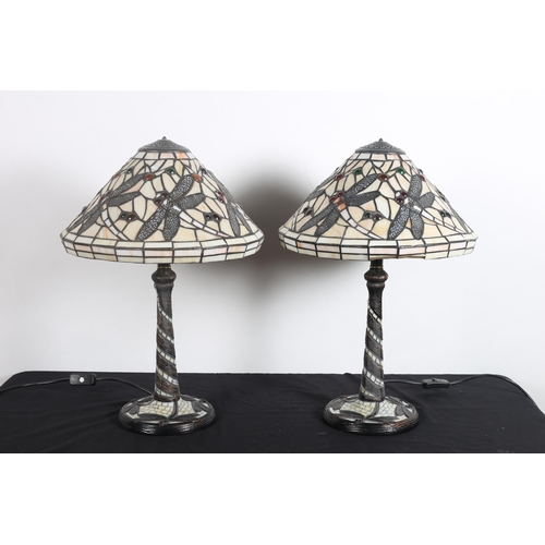 94 - A PAIR OF TIFFANY STYLE TABLE LAMPS each with a dome shade inset with multicoloured panels decorated... 