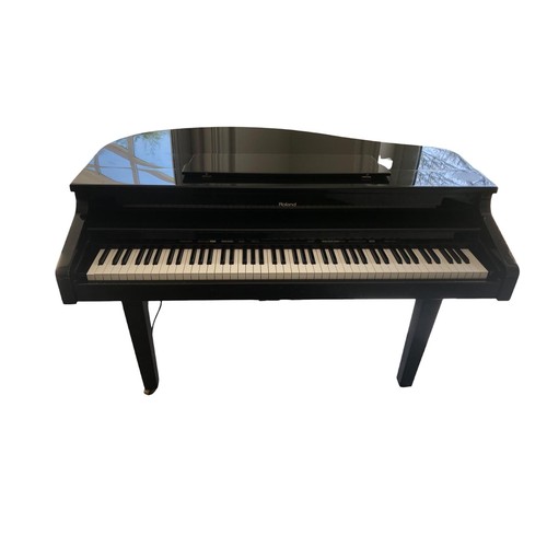 409 - A ROLAND BLACK LACQUERED CASED FLOPPY DISC ELECTRONIC PIANO with stool 
92cm (h) x 138cm (w) x 93cm ... 