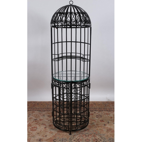 33 - A FREESTANDING WROUGHT IRON WINE BAR of cylindrical dome form with scroll decoration and glazed shel... 