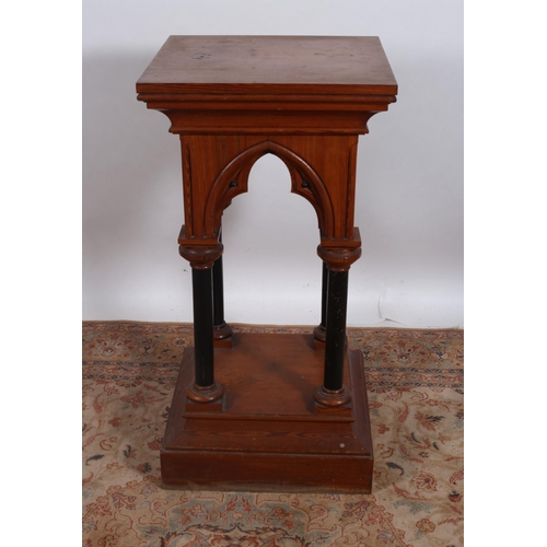 70 - A 19TH CENTURY GOTHIC STYLE PINE PEDESTAL of square outline the shaped top above gothic point arches... 