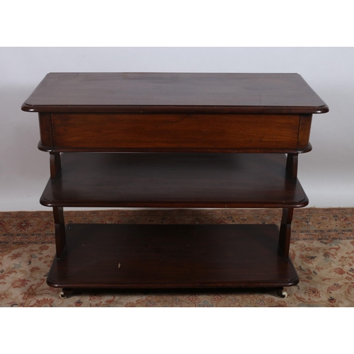 72 - A 19TH CENTURY MAHOGANY THREE TIER TABLE of rectangular outline the shaped top with frieze drawer ab... 