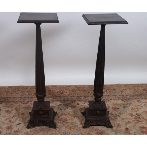 73 - A PAIR OF REGENCY STYLE MAHOGANY JARDINIERE STANDS each of square outline the shaped tops above a fl... 