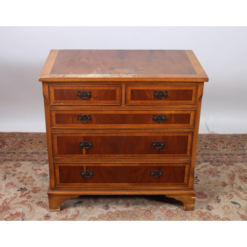 222 - A YEW WOOD CHEST of rectangular outline the shaped top above two short and three long graduated draw... 