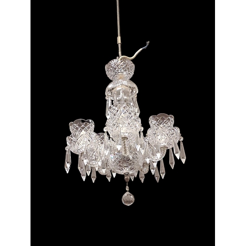 164 - A TARA CRYSTAL FIVE BRANCH CHANDELIER with spiral twist scroll arms hung with faceted pendants (AF) ... 