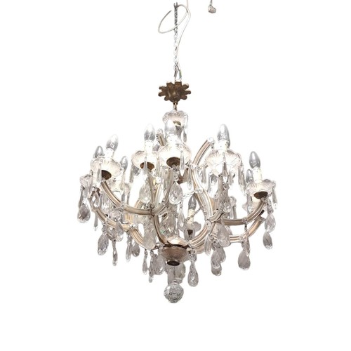 341 - A CONTINENTAL CUT GLASS FIFTEEN BRANCH CHANDELIER in two registers the openwork frame hung with face... 