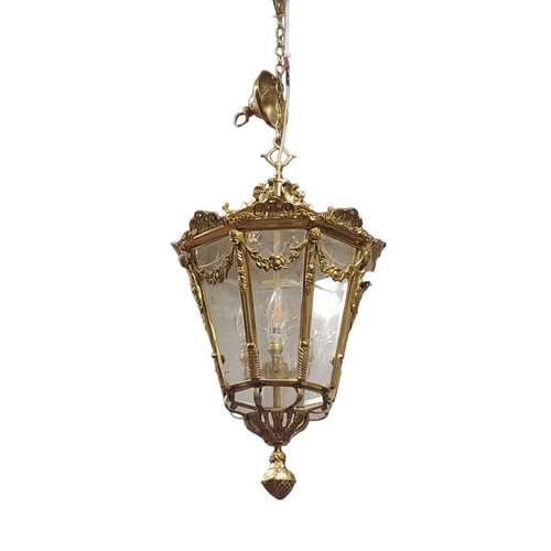 342 - A GILT BRASS AND ENGRAVED GLASS FOUR LIGHT LANTERN of octagonal tapering form with engraved and beve... 