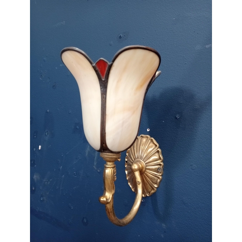 709 - A TIFFANY STYLE GILT BRASS AND GLAZED WALL LIGHT with scroll arm and tulip arm with oval backplate 2... 