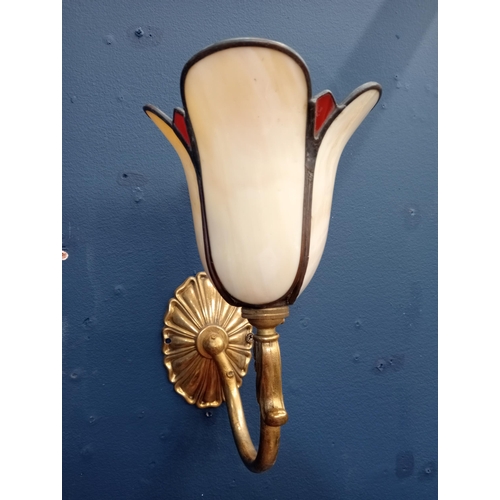 709 - A TIFFANY STYLE GILT BRASS AND GLAZED WALL LIGHT with scroll arm and tulip arm with oval backplate 2... 