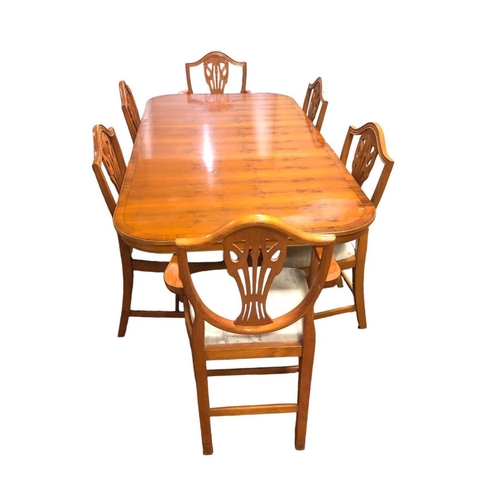 1 - A YEW WOOD ELEVEN PIECE DINING ROOM SUITE comprising SIX DINING CHAIRS, including a pair of elbow ch... 