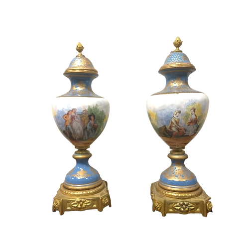 106 - A PAIR OF CONTINENTAL PORCELAIN AND GILT BRASS LIDDED VASES each of bulbous form the turquoise white... 