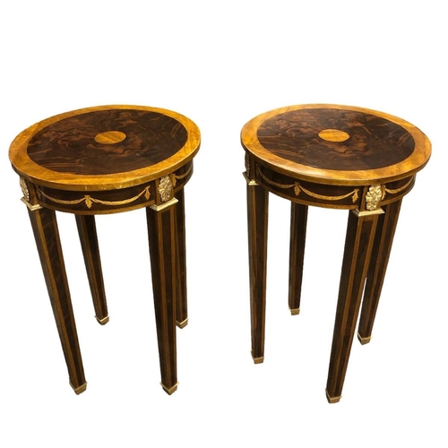 17 - A PAIR OF CONTINENTAL WALNUT INLAID AND GILT BRASS MOUNTED TABLES each of circular outline the shape... 