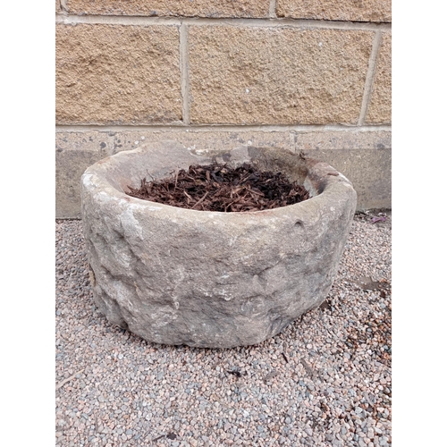 170 - A 19TH CENTURY YORKSHIRE STONE TROUGH of cylindrical form 26cm (h) x 48cm (d)