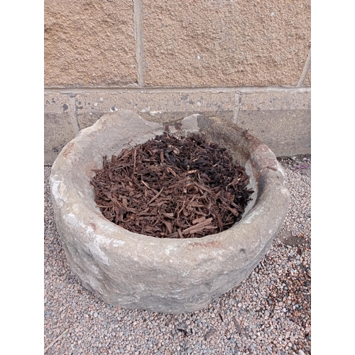 170 - A 19TH CENTURY YORKSHIRE STONE TROUGH of cylindrical form 26cm (h) x 48cm (d)