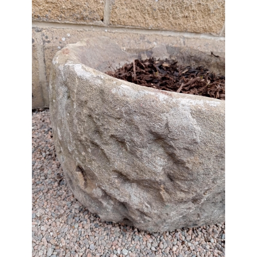 170 - A 19TH CENTURY YORKSHIRE STONE TROUGH of cylindrical form 26cm (h) x 48cm (d)