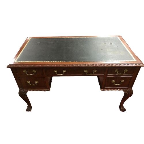 178 - A VINTAGE MAHOGANY DESK of rectangular outline the shaped top with tooled leather inset, two short a... 