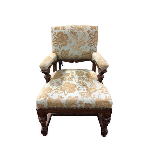 179 - A VINTAGE WALNUT AND UPHOLSTERED ARMCHAIR the rectangular upholstered back and seat and arm rests jo... 