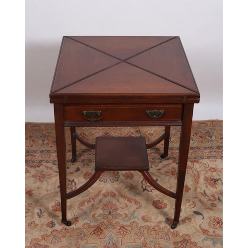 241 - AN EDWARDIAN MAHOGANY ENVELOPE CARD TABLE the square moulded top with hinged leaves containing baize... 