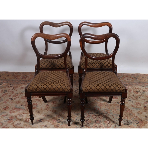 244 - A SET OF FOUR 19TH CENTURY ROSEWOOD DINING CHAIRS each with a curved top rail and splat with upholst... 