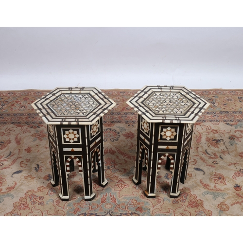 256 - A PAIR OF VINTAGE MOROCCAN TABLES each of octagonal outline inlaid overall with mother of pearl and ... 