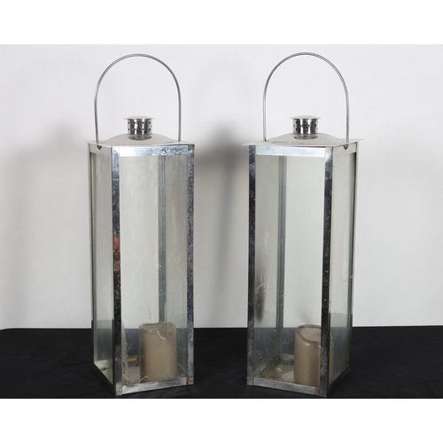 270 - A PAIR OF CHROME AND GLAZED LANTERNS each of square form with carrying handles 69cm (h) x 20cm (w) x... 