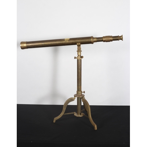 271 - A BRASS TELESCOPIC TELESCOPE on adjustable tripod base 133cm (h) x 72cm (w)