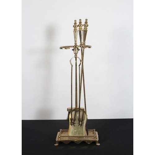 272 - A BRASS COMPANION SET on stand comprising poker, shovel, tongs and brush 74cm (h)