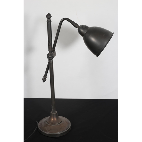 276 - A COPPER AND WHITE METAL ADJUSTABLE READING LAMP the cylindrical column with adjustable arm and shad... 