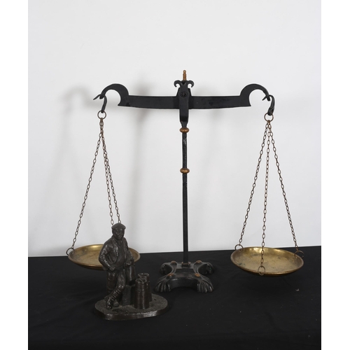 278 - A VINTAGE BRASS AND CAST IRON SCALES the cylindrical knopped and square column on a shaped platform,... 