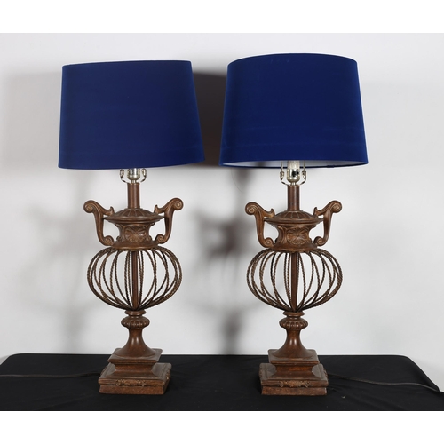 279 - A PAIR OF COMPOSITION BRONZED AND WIRE WORK TABLE LAMPS each with an open spherical column surmounte... 