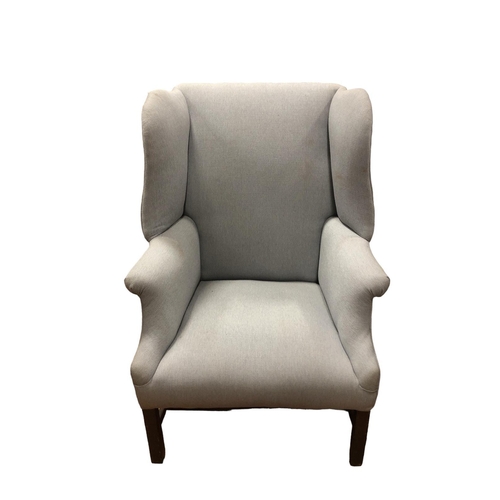 30 - A GEORGIAN MAHOGANY AND UPHOLSTERED WING CHAIR the scroll over arms on square tapering legs joined b... 