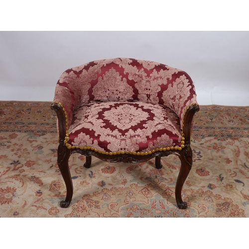 305 - A CONTINENTAL STAINED WOOD AND UPHOLSTERED STOOL the tub shaped upholstered back and seat with brass... 