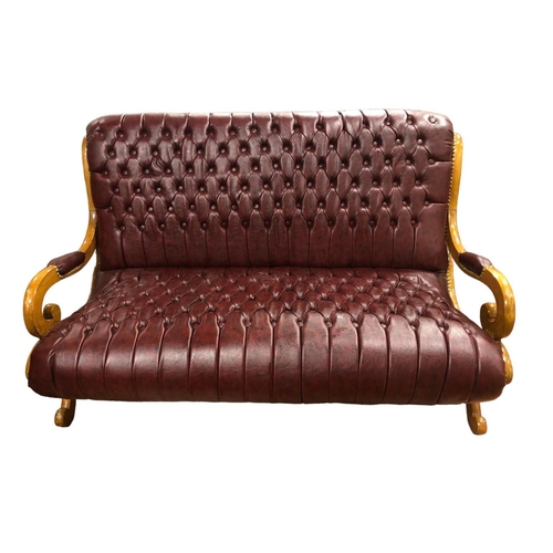 31 - A HARDWOOD AND UPHOLSTERED SETTEE the deep buttoned upholstered back and seat with scroll arms and s... 