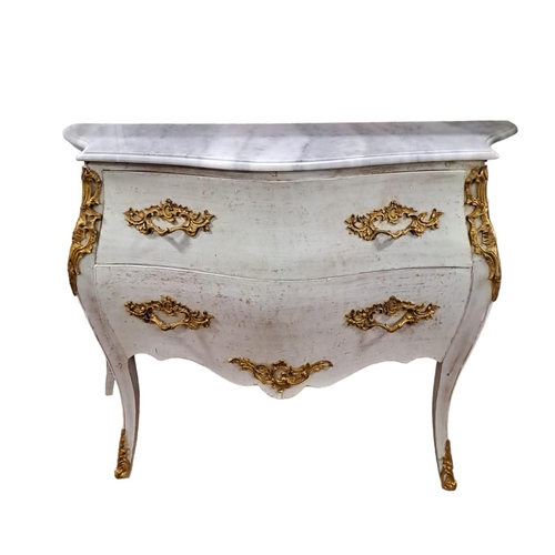 354 - A CONTINENTAL CREAM PAINTED AND GILT BRASS MOUNTED CHEST of bombe outline surmounted by a white vein... 