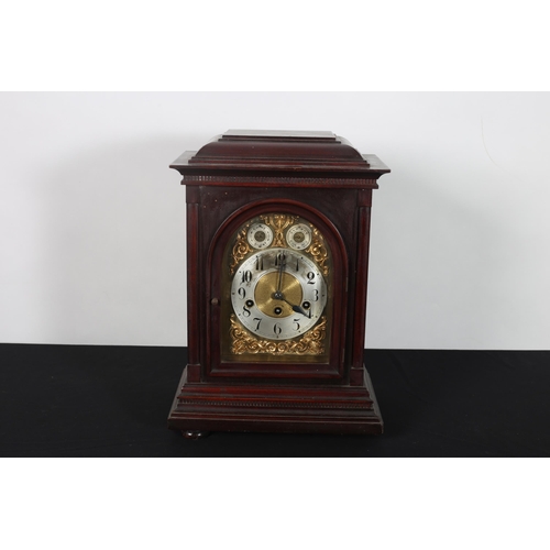 373 - AN EDWARDIAN MAHOGANY CASED BRACKET CLOCK the rectangular moulded case containing a brass and silver... 