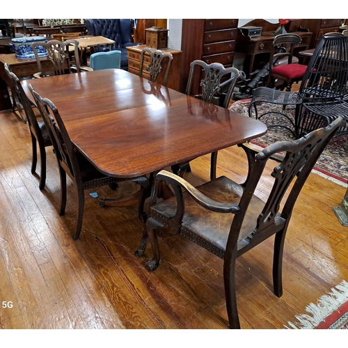 377 - A SEVEN PIECE MAHOGANY DINING ROOM SUITE comprising six Chippendale style dining chairs, including a... 