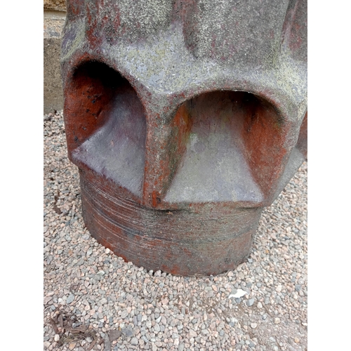 380 - A PAIR OF GLAZED TERRACOTTA CHIMNEY STACKS each of cylindrical lobed form 100cm (h) x 40cm (d)