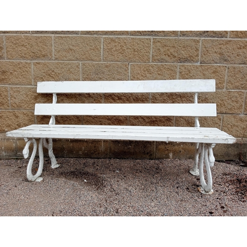 382 - A CAST IRON AND PINE PAINTED BENCH the slatted back and seat on serpent supports on pad feet 80cm (h... 