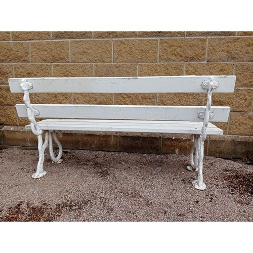 382 - A CAST IRON AND PINE PAINTED BENCH the slatted back and seat on serpent supports on pad feet 80cm (h... 