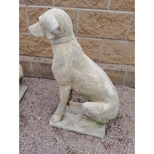 387 - A PAIR OF COMPOSITION STONE FIGURES each modelled as a hound shown seated on a rectangular base 72cm... 