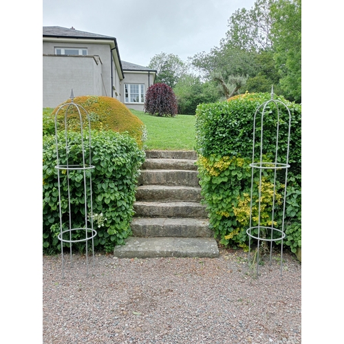 388 - A PAIR OF WROUGHT IRON OBELISKS each of dome form with fleur de lis mount 210cm (h) x 49cm (d)