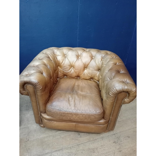 392 - A PAIR OF HIDE UPHOLSTERED CLUB CHAIRS each with deep buttoned upholstered scroll over back and arms... 